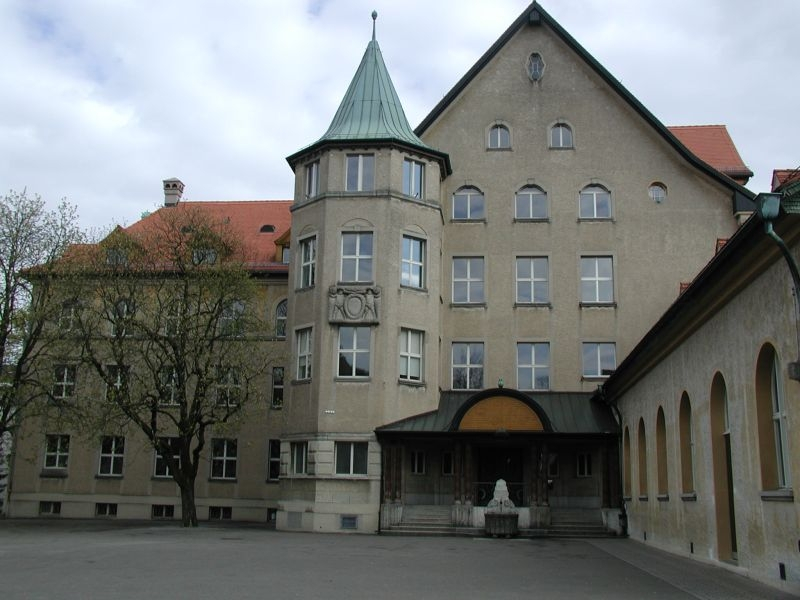 Photo of the main school building with the entrance to the sport hall